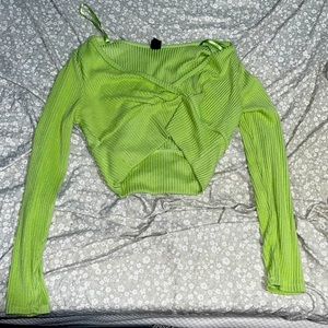 Green crop top, long sleeved.